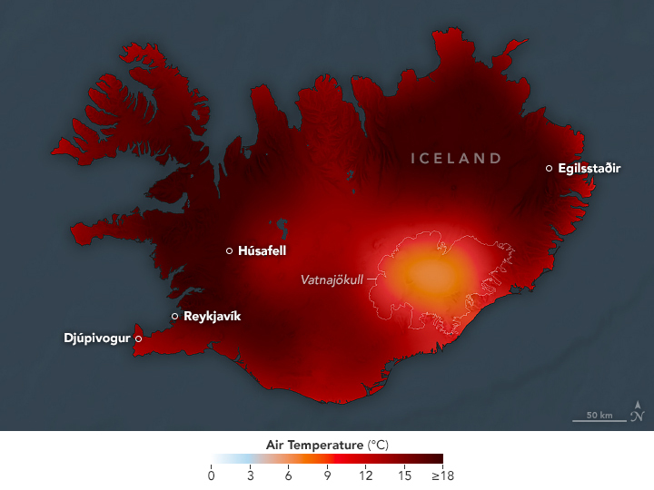 Air temperatures are displayed on a map of Iceland. Cooler areas appear yellow to orange, and warmer areas appear red to dark red. Except for the ice caps near the middle and lower right of the island, which appear orange, most of the island is dark red.